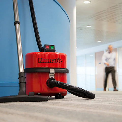 Front view of the Numatic NQS250B Commercial Vacuum Cleaner in the office environment