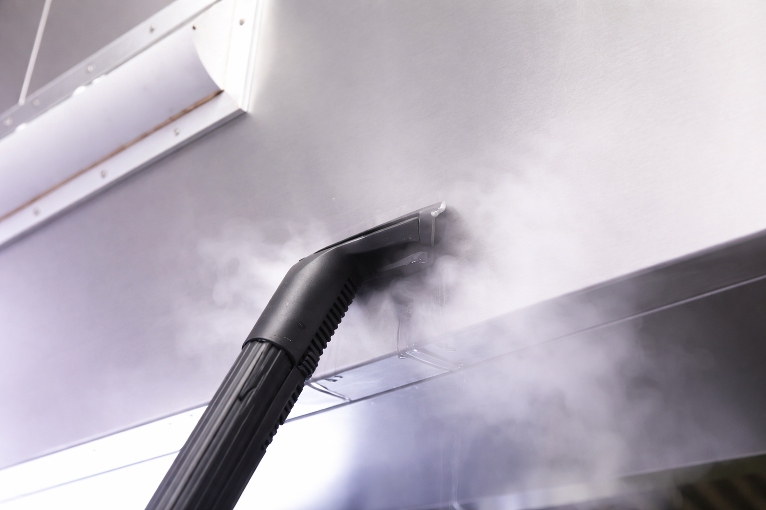 Steam nozzle in use on Nilfisk SDV800 steam cleaner delivering high-temperature sanitising steam
