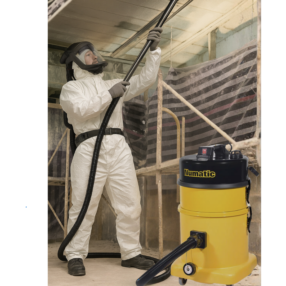 Operator using Numatic HZD570 for hazardous dust removal in industrial or asbestos-related environments