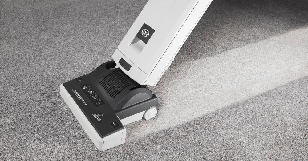 Image of the SEBO XP10 Upright Commercial Vacuum Cleaner being used on the carpet