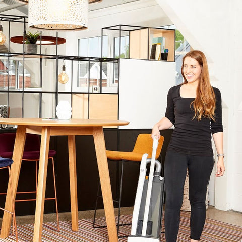 Image of the SEBO BS360 Upright Commercial Vacuum Cleaner being used on the carpet