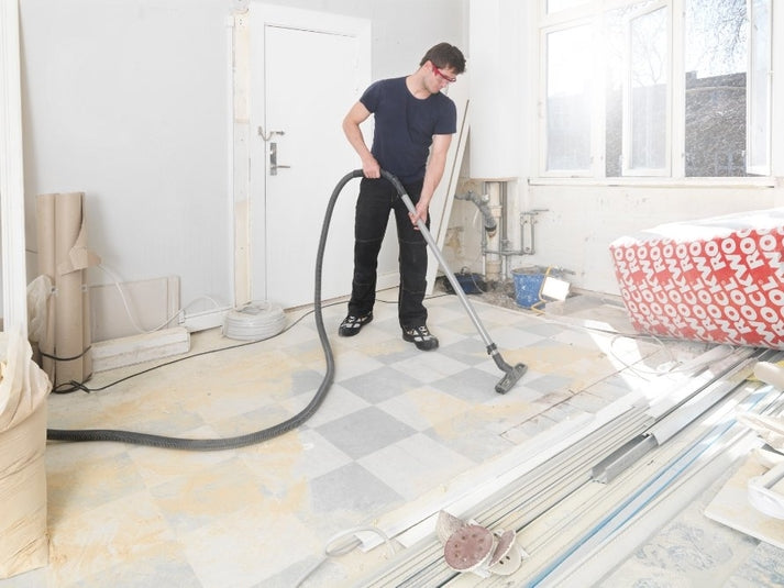 Nilfisk Attix 50-01 PC wet and dry vacuum cleaning slurry and debris on building site