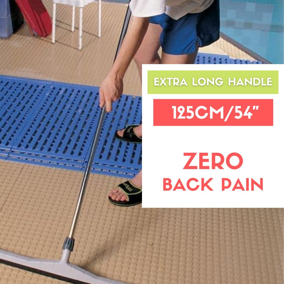 Worker using heavy-duty floor squeegee to remove water from tiled floor in wet room or changing area