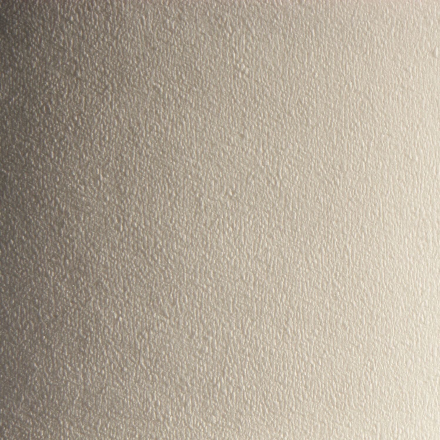 Close-up of white centrefeed paper towel texture showing absorbent embossed surface