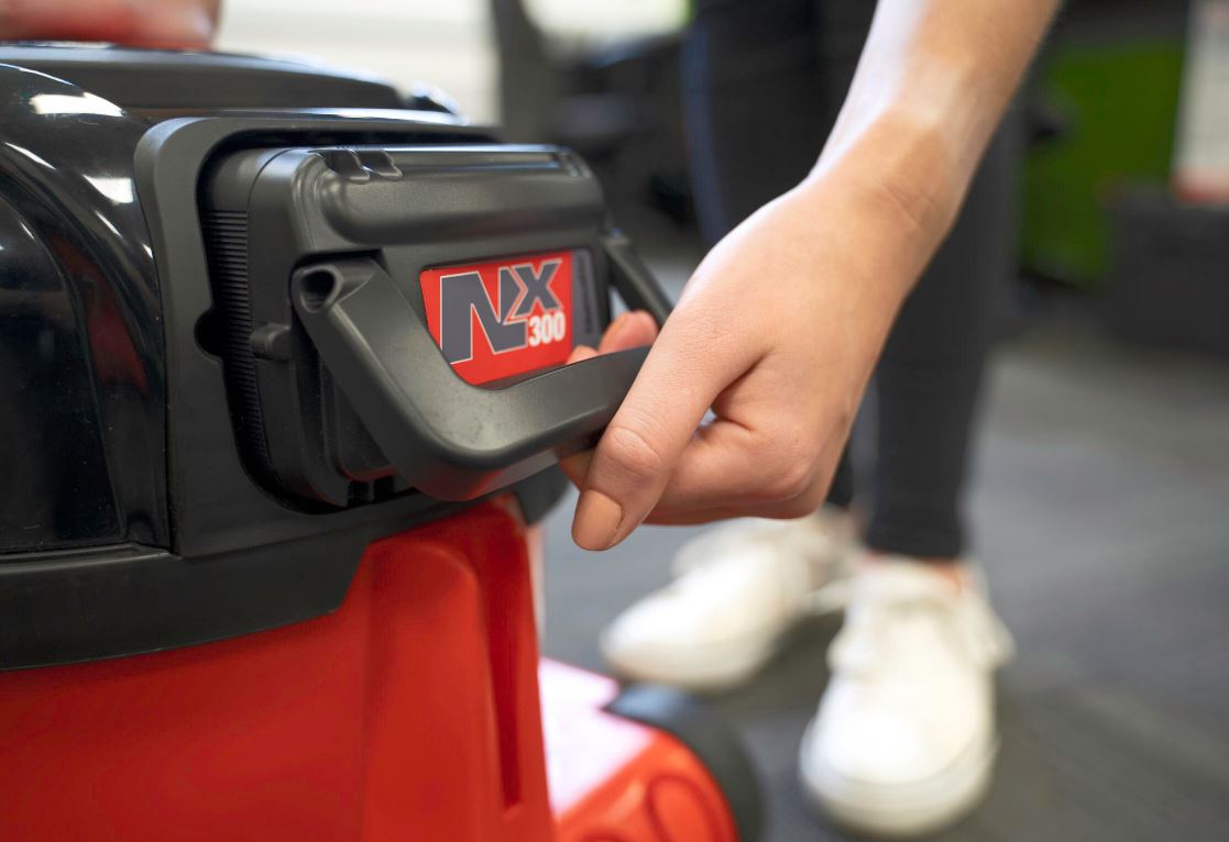 NX300 lithium battery being removed from the Numatic NBV240NX cordless Henry