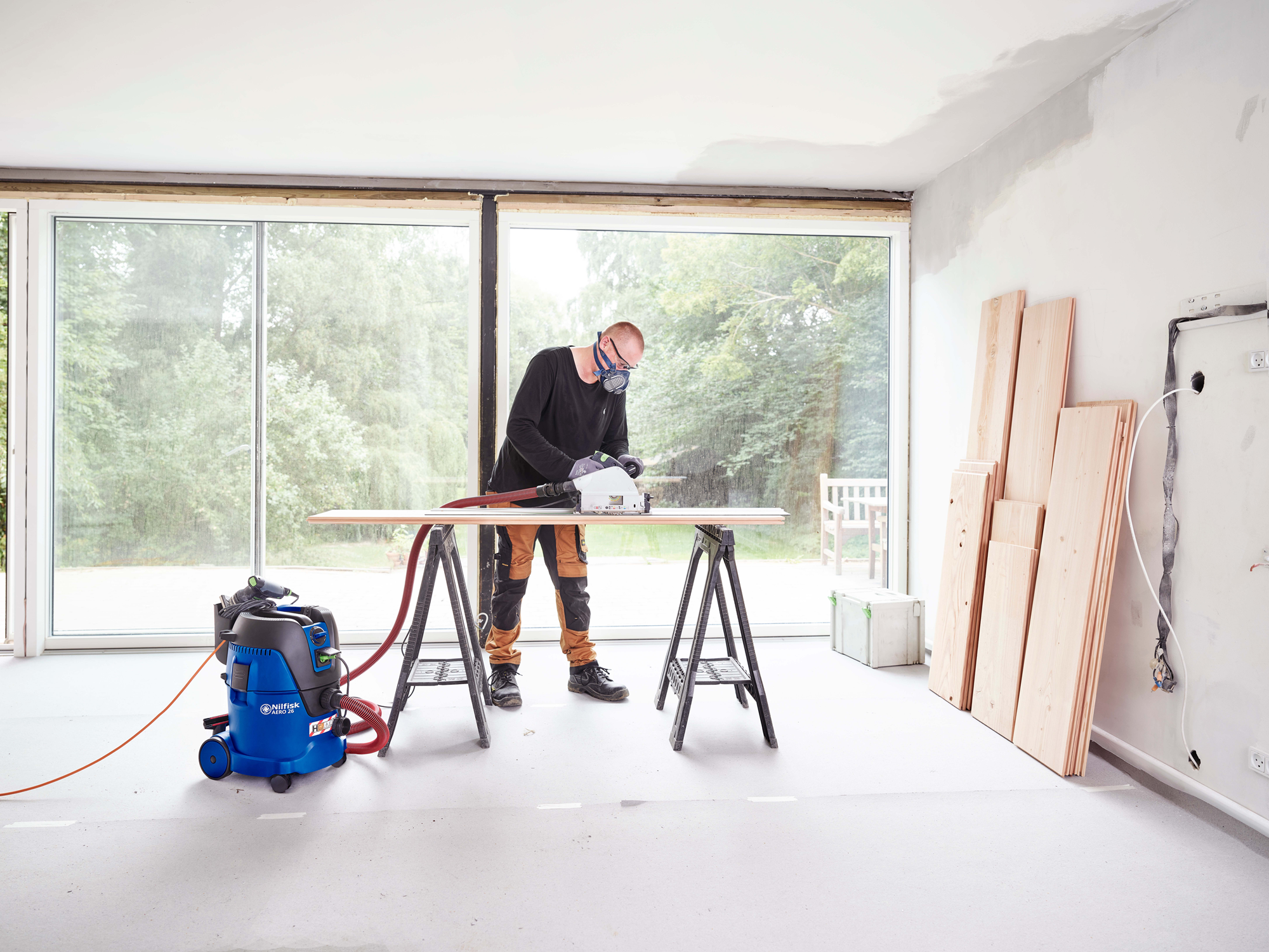 Nilfisk Aero 26-2H dust extractor removing hazardous dust in commercial construction environment