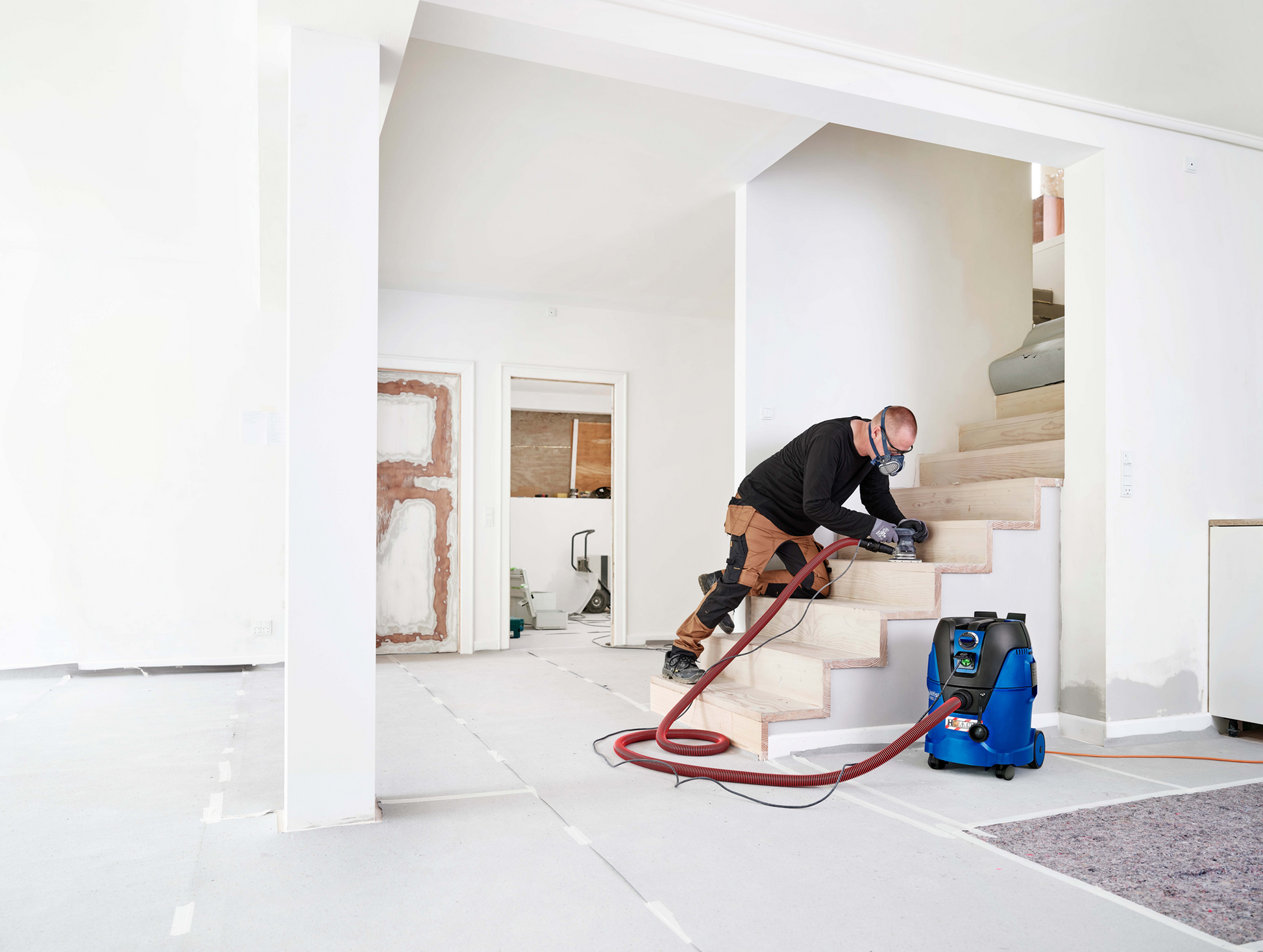 Nilfisk Aero 26-2H being used indoors to remove fine hazardous dust during renovation work