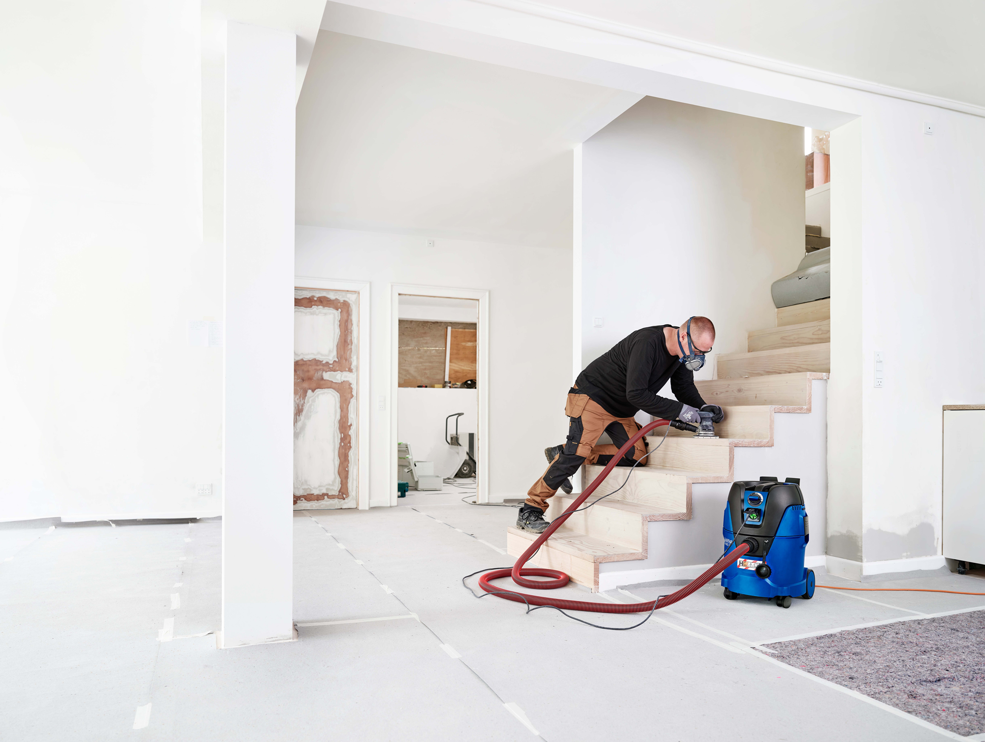 Nilfisk Aero 26-2H being used indoors to remove fine hazardous dust during renovation work