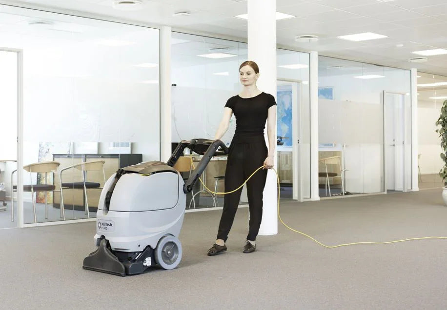 Nilfisk ES300 carpet extractor cleaning office carpets in a commercial environment