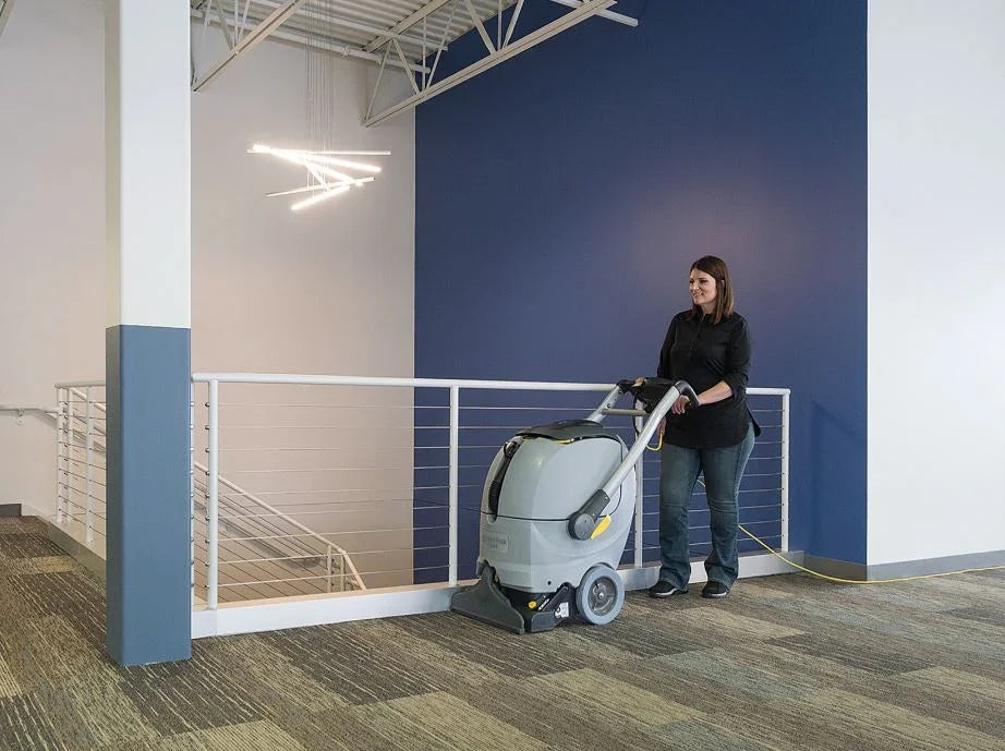 Nilfisk ES300 professional carpet cleaner performing deep cleaning in commercial premises