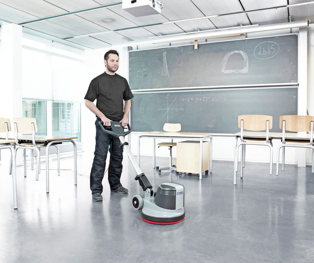 Nilfisk FM400D floor scrubber polisher being used in a commercial environment