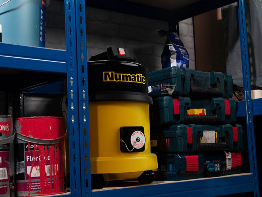 Numatic HZ370 hazardous dust vacuum used in industrial warehouse environment for safe dust extraction