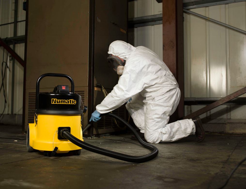 Operator using Numatic HZ390L H-Class extractor indoors for safe removal of asbestos and dangerous dust