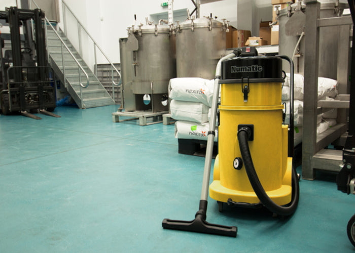 Numatic HZD900 vacuum in use on industrial site for hazardous dust extraction and safe cleanup