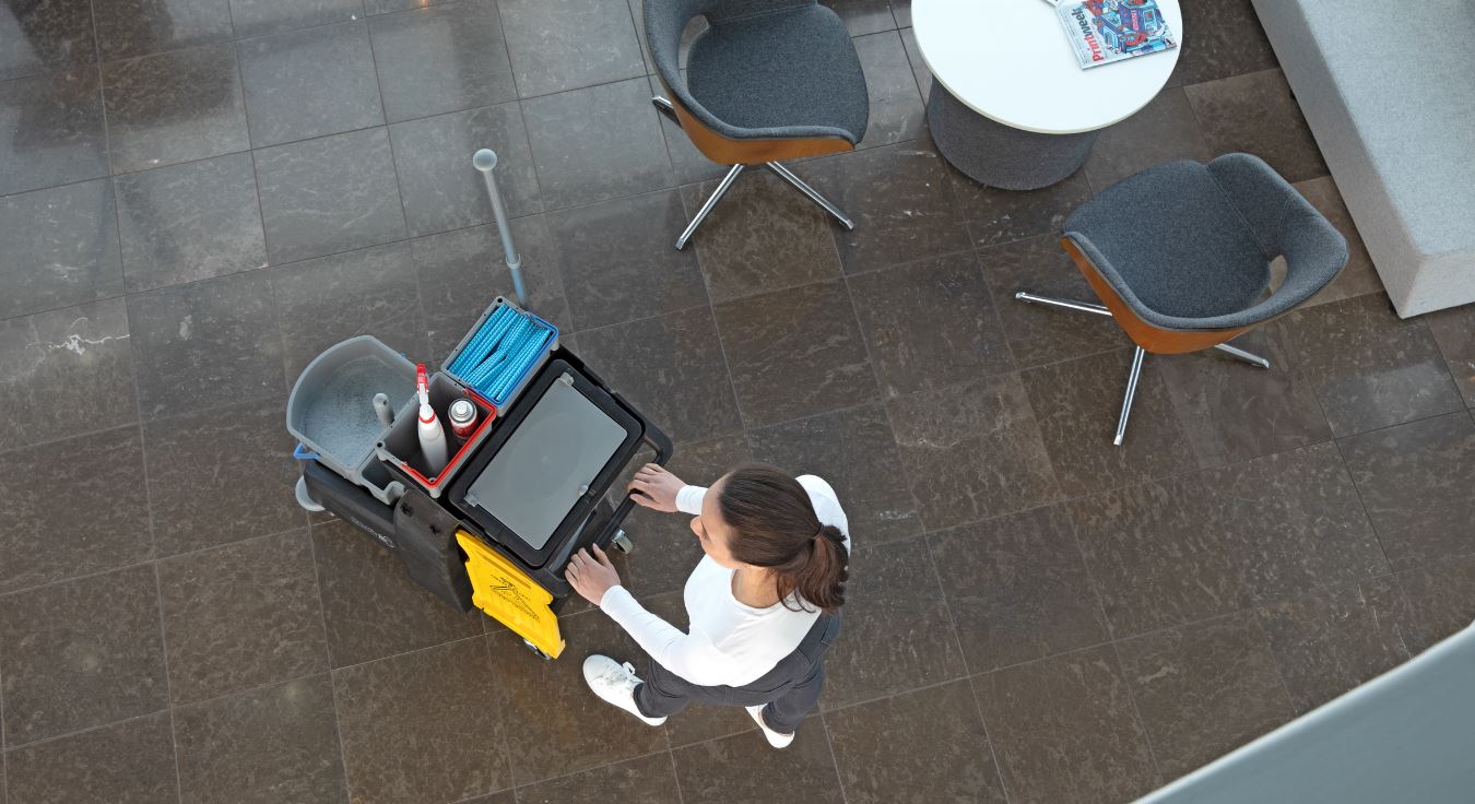 Top-down view of Numatic MM4 cleaning cart with mop press and storage configuration
