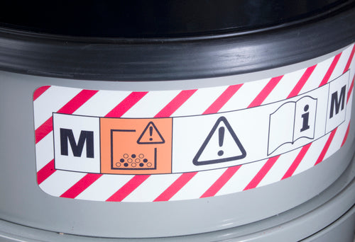 Close-up of M-Class certification and hazard markings on the Numatic MV570 dust extractor
