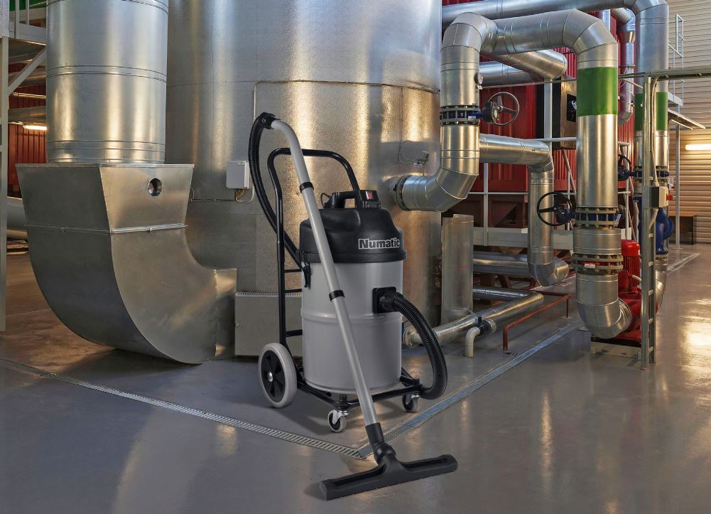 Numatic NTD750-2 industrial dust extractor being used in a commercial cleaning environment